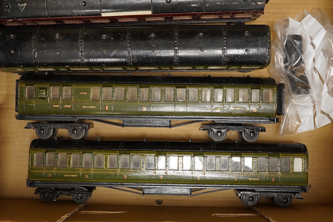 Four 0 gauge 1930s wooden Bonds bogie coaches; three Southern Railway; a Composite Brake, and two First Third Composites, and an LMS First Third Composite